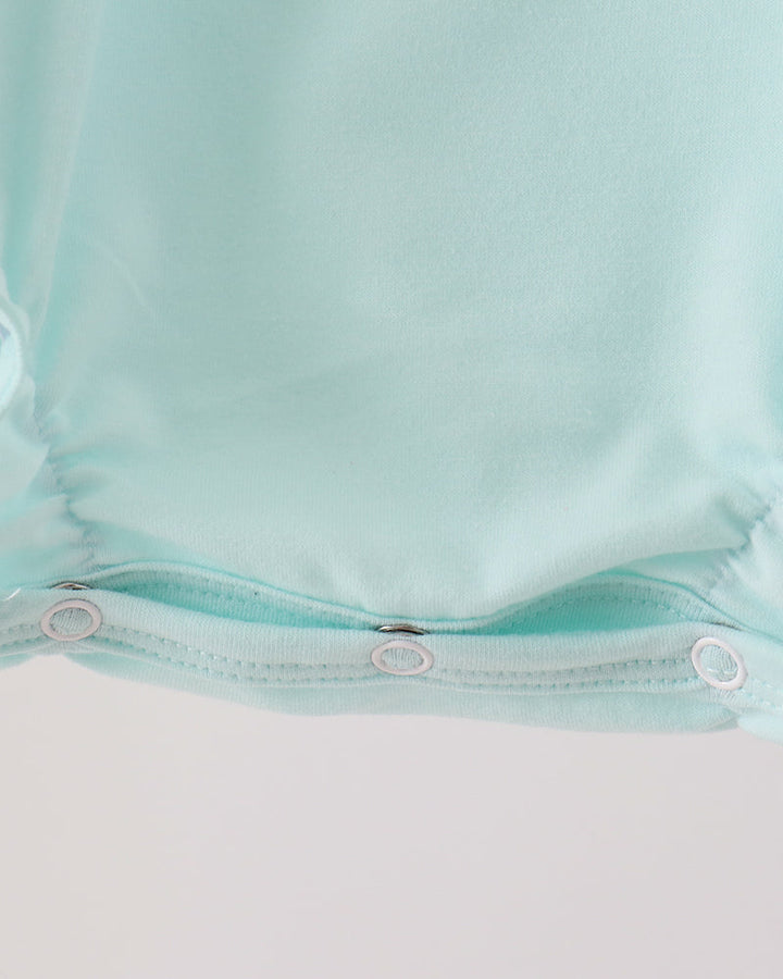 Mint green bubble romper button placket with two snaps