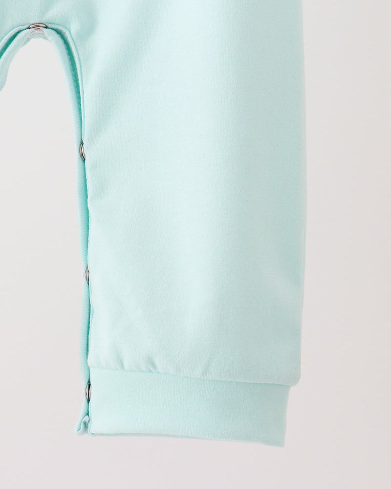 Light blue toddler romper with front leg opening and stitched seam detail