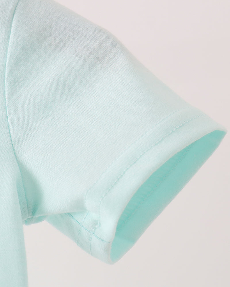 Light blue romper sleeve cuff with visible fabric stitching