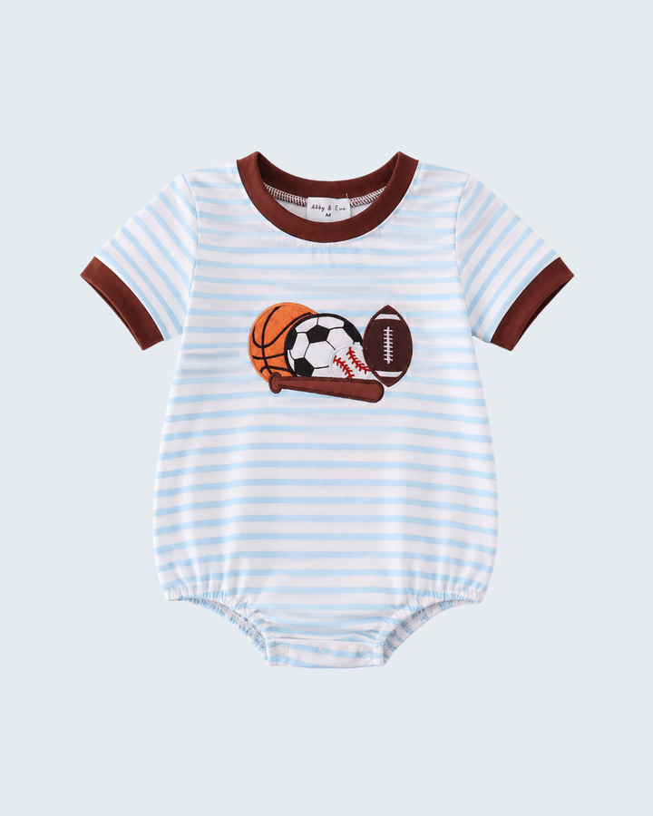 Baby romper with sports ball graphics on a light gray background