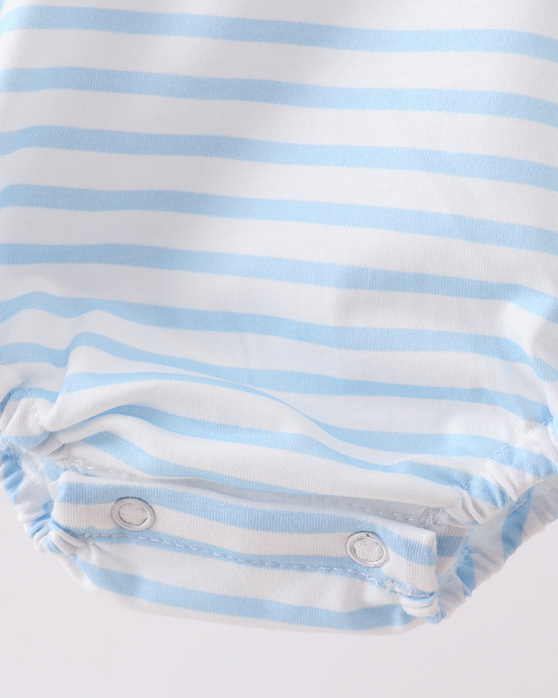 Close-up of a baby romper with blue and white stripes on a light gray background
