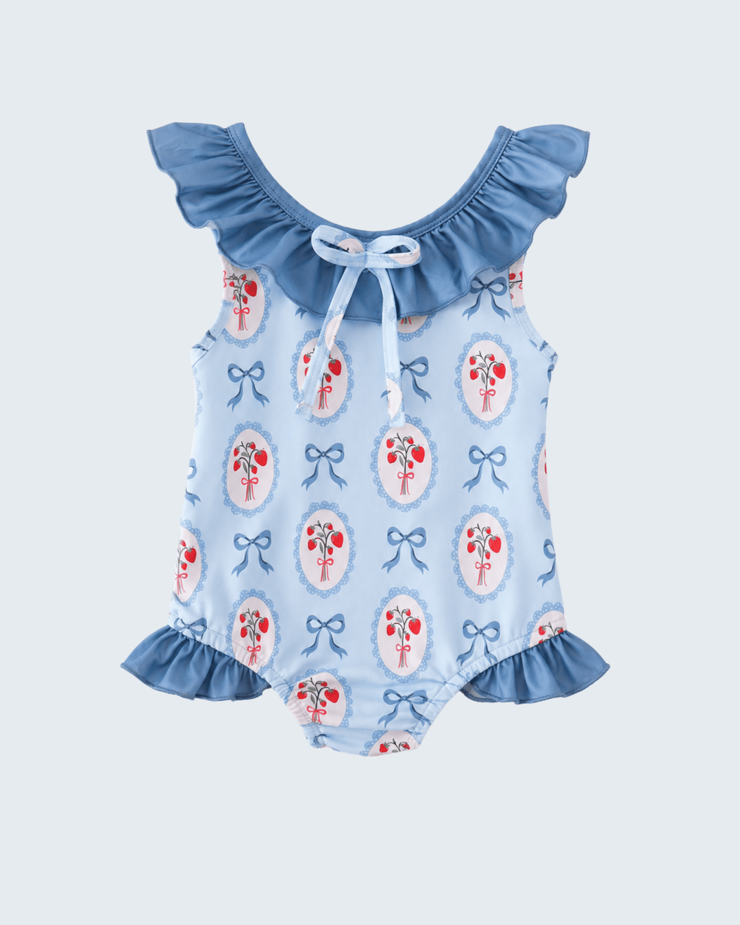 Swimsuit with floral and bow pattern on a light blue background