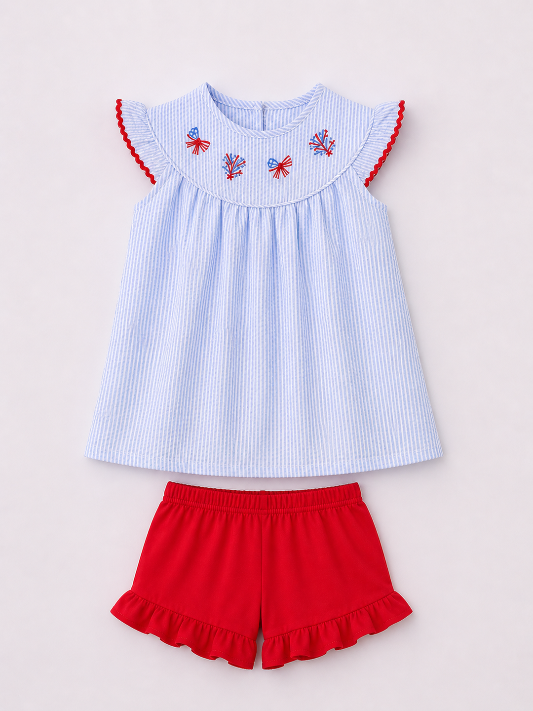 Light blue striped top with red trim and red shorts on a light gray background