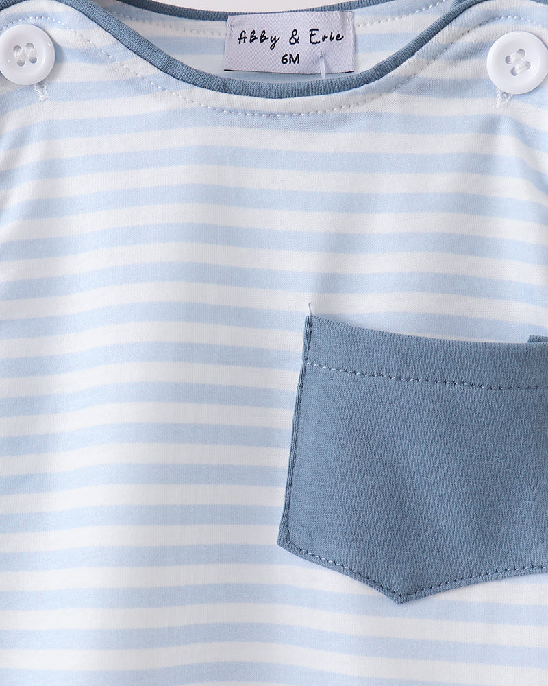 Close-up of a baby outfit with blue and white stripes and a pocket, brand &
