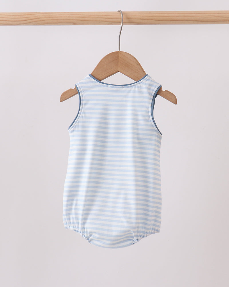 Striped baby romper on a wooden hanger against a white background