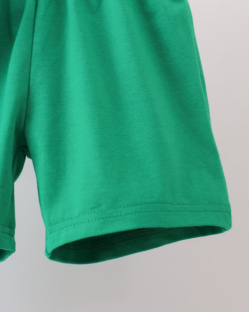 Green shorts with stitched hem and smooth fabric