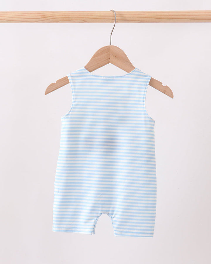 A sleeveless baby romper with light blue and white horizontal stripes, hanging on a wooden hanger from a wooden clothing rack against a plain off-white background.