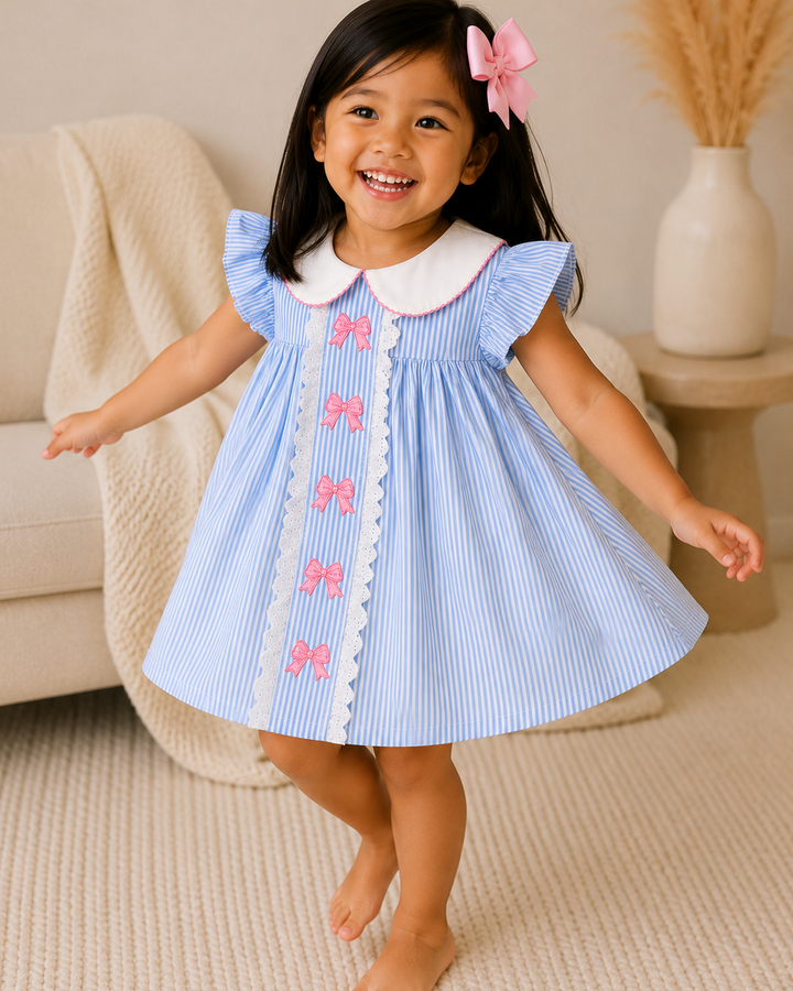 Girl twirling in blue dress in living room