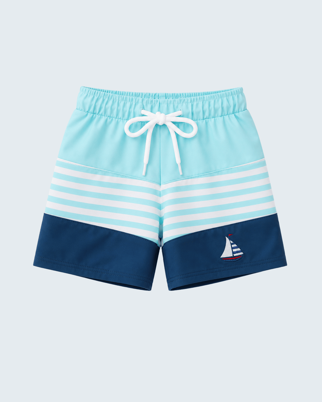 Blue and white striped shorts with a sailboat design on a light blue background