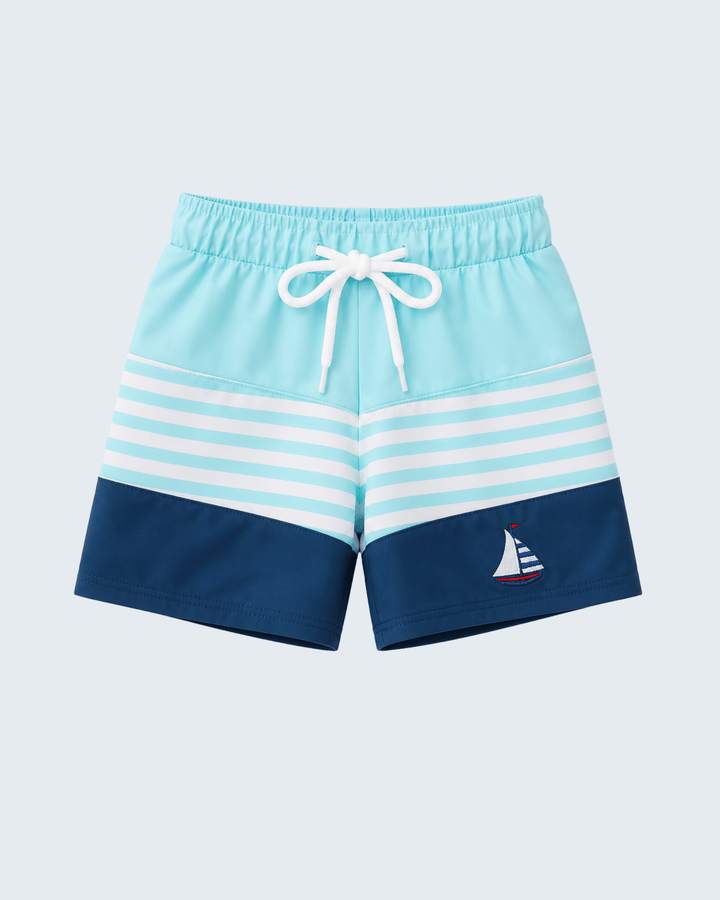 Blue and white striped shorts with a sailboat design on a light blue background