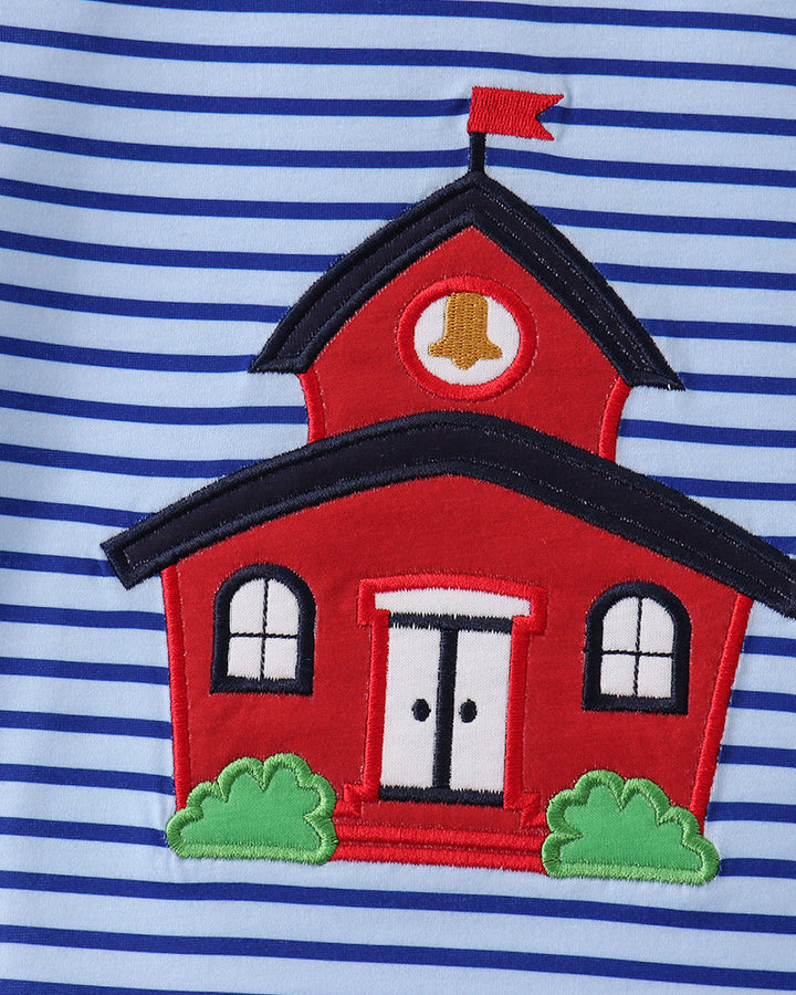 Close-up of blue striped T-shirt with red house applique and green yard