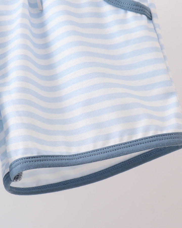 Close-up of a blue and white striped fabric with a plain background