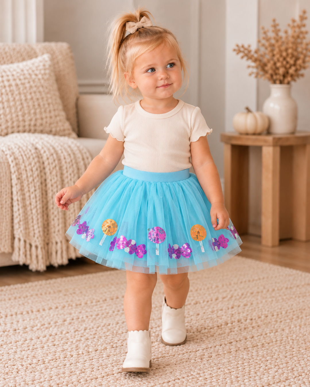 Light blue sequin tutu skirt with purple flower and gold dot details, layered tulle.