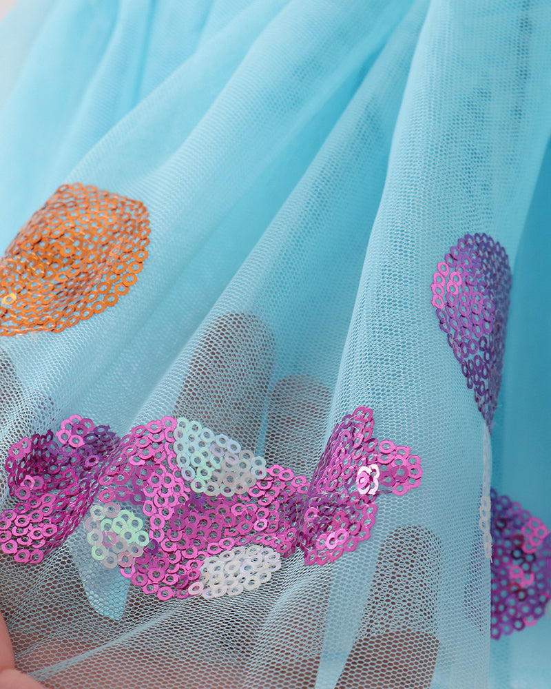 Blue tulle tutu skirt with layered heart sequin patches in orange, purple, and silver