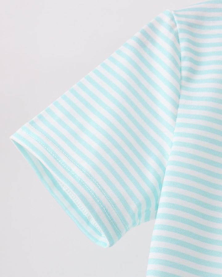 Light blue striped polo shirt sleeve with curved hem and folded cuff detail
