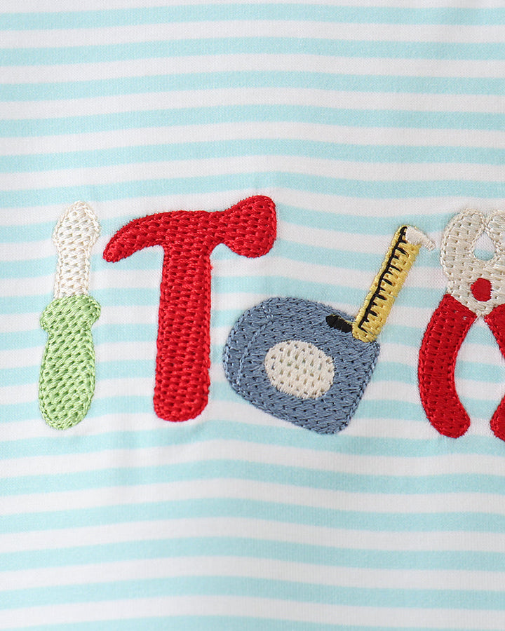 Tool-themed embroidery detail on light blue and white striped T-shirt