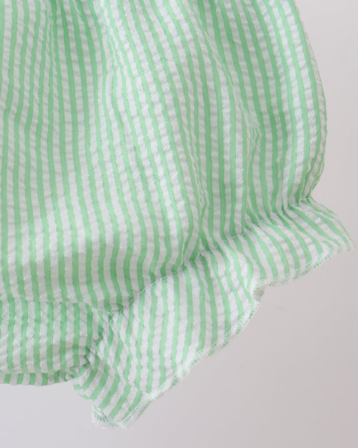 Green and white checkered shorts on a light gray background