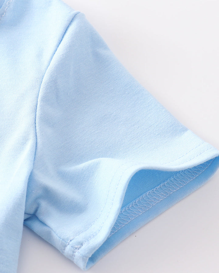 Close-up of a light blue fabric with a white background