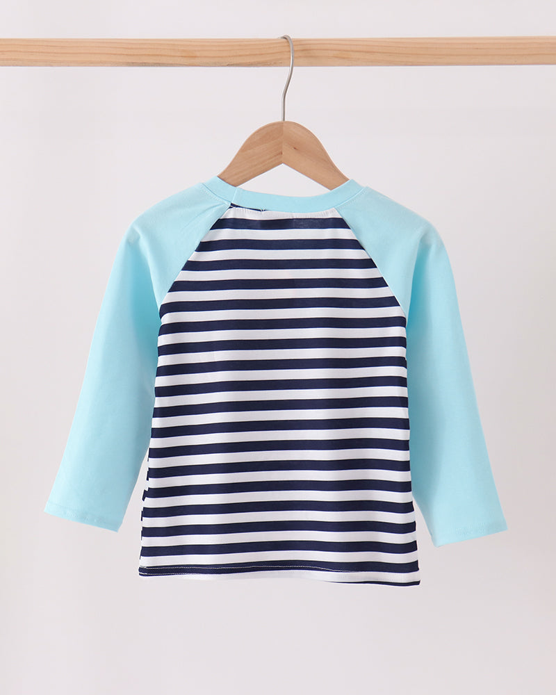 Navy-and-white striped raglan top with light blue sleeves