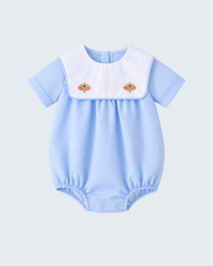 Blue checkered bubble romper with white yoke and two turkey appliques