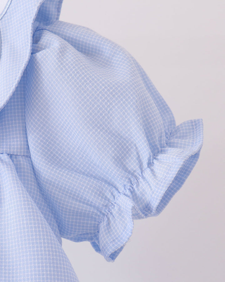 Light blue checkered dress with gathered sleeve and ruffled cuff