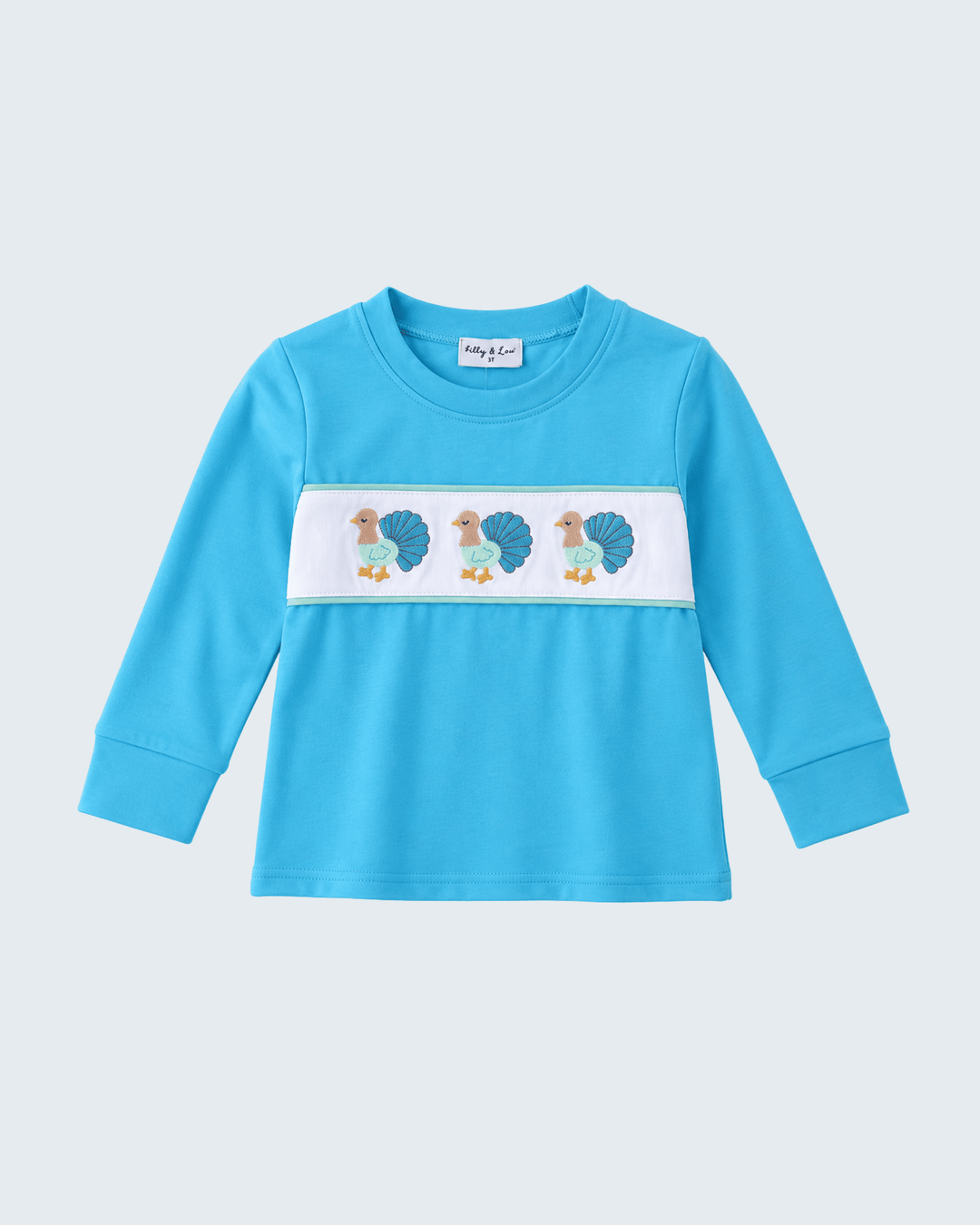 Light blue long-sleeve top with embroidered turkey design panel and crew neck