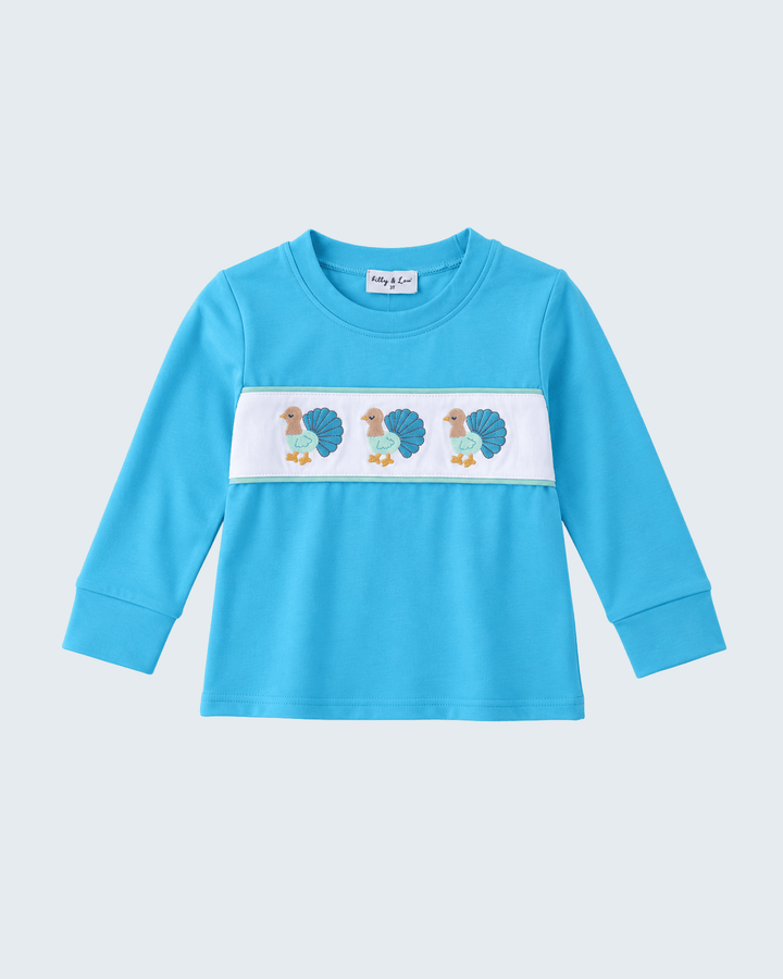 Light blue long-sleeve top with embroidered turkey design panel and crew neck