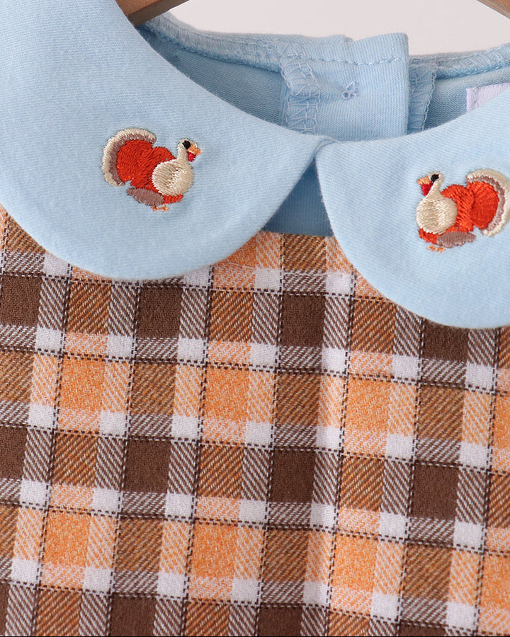 Light blue collar with turkey embroidery patches on plaid dress