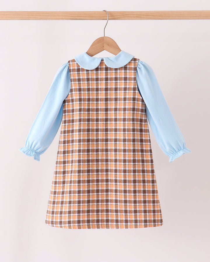 Plaid pinafore dress with light blue long sleeves and peter-pan collar