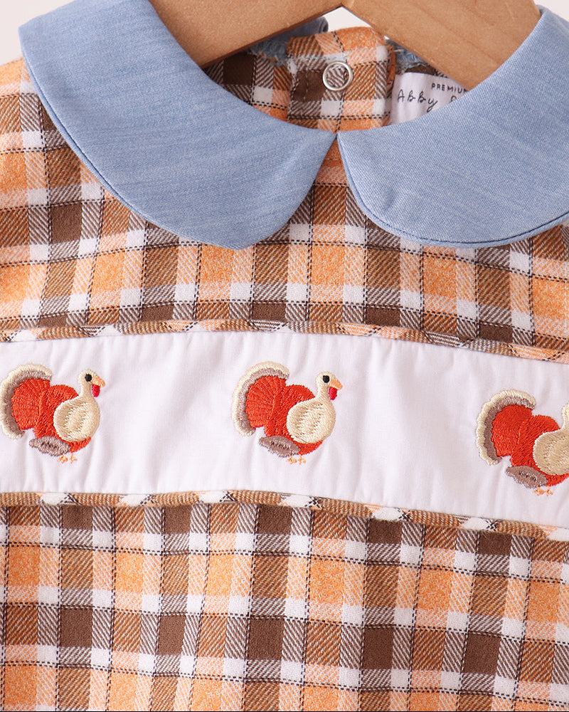 Turkey-embroidered baby bubble romper with blue Peter Pan collar and check yoke