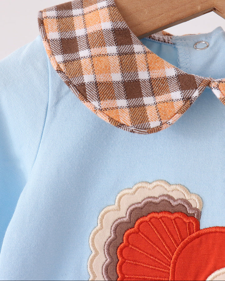 Light blue romper with brown plaid Peter Pan collar and embroidered turkey patch