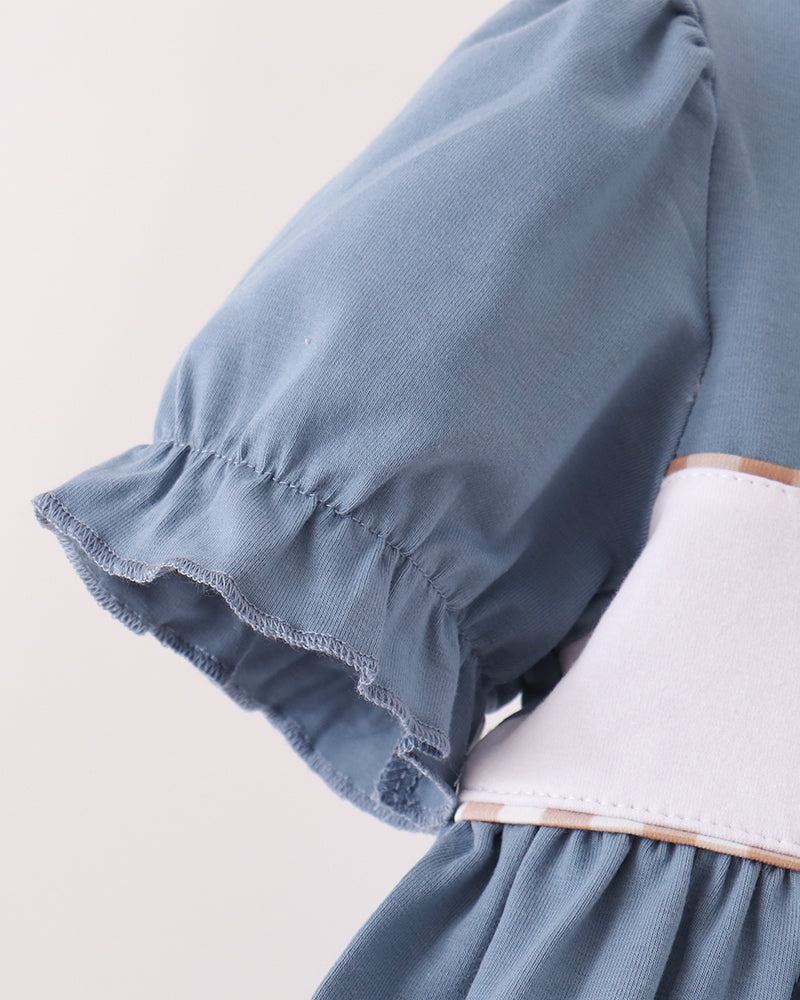 Blue gathered puff sleeve with white contrast neckline and hem trim