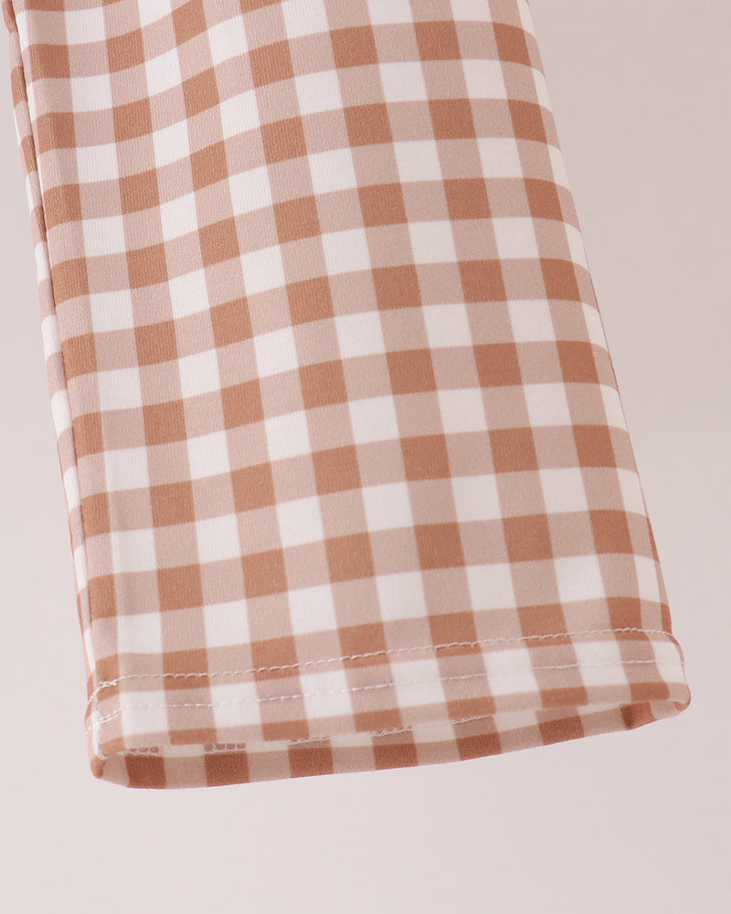 Orange and white gingham pants with stitched hem