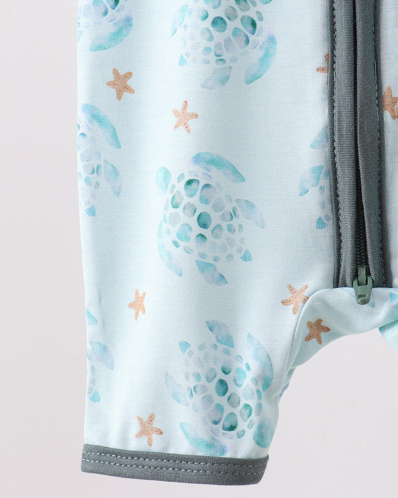 Close-up of a product with turtle and starfish pattern on a light blue background