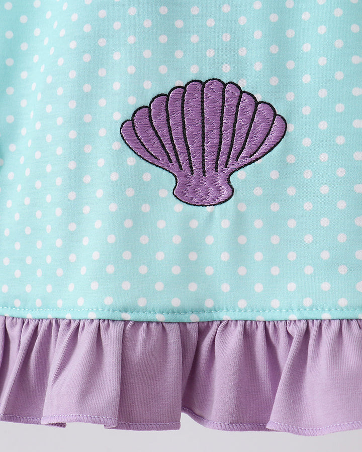 Sea shell embroidery on blue polka dot dress