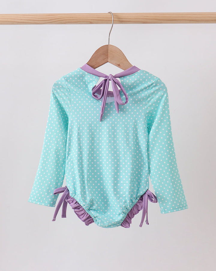 Blue Under The Sea Embroidered UPF Rashguard on wooden hanger