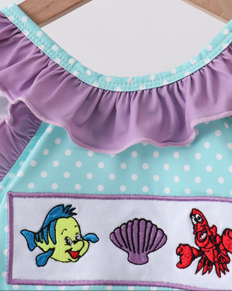 Swimsuit with embroidered characters