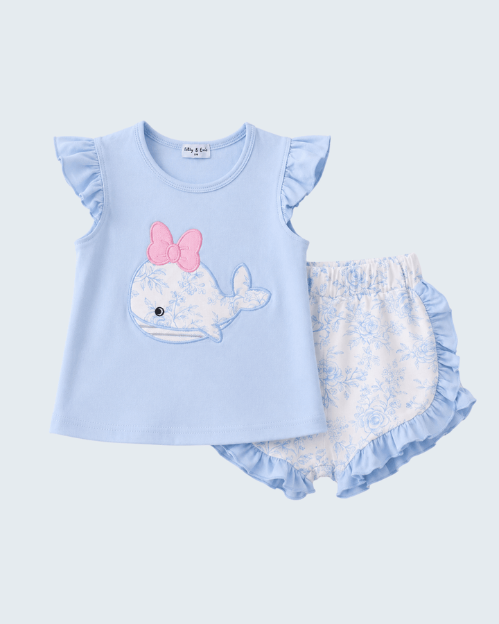 Shorts outfit with light blue top and floral bloomers on a white background