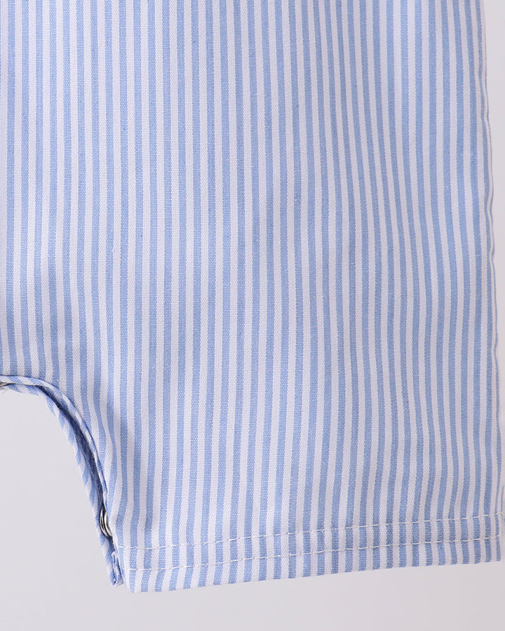 Close-up of a blue and white striped fabric with a plain background