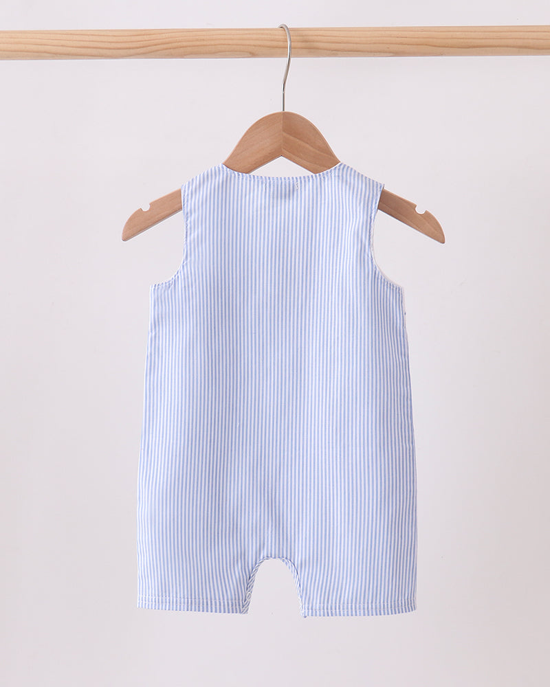 Blue and white striped baby romper on a hanger against a light background