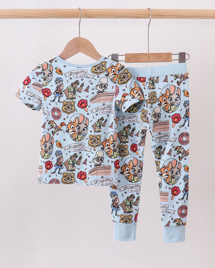Light blue cartoon character 2-piece pajama set with short sleeves and cuffed legs