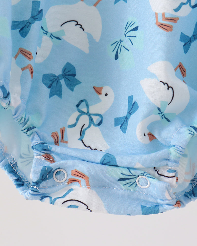Light blue goose print bubble romper with gathered waist and flutter leg ruffles