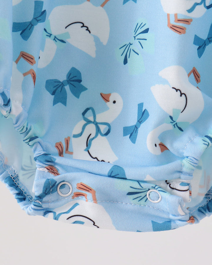 Light blue goose print bubble romper with gathered waist and flutter leg ruffles
