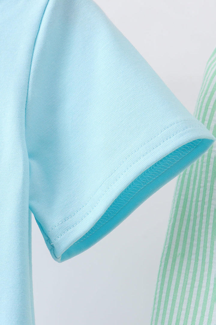 Close-up of a light blue fabric edge with a white background