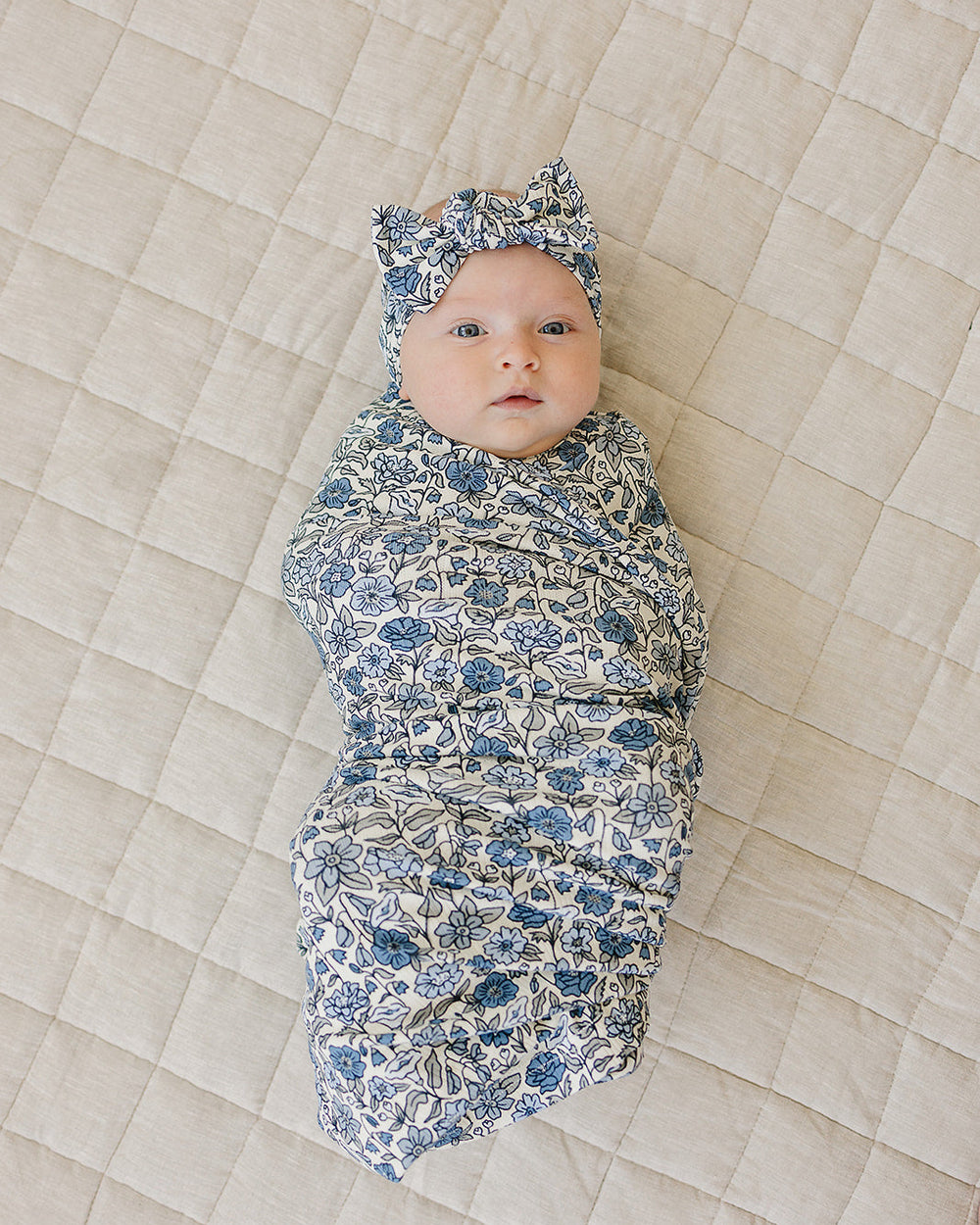 Baby head wrap with blue-and-white floral print and top knot bow