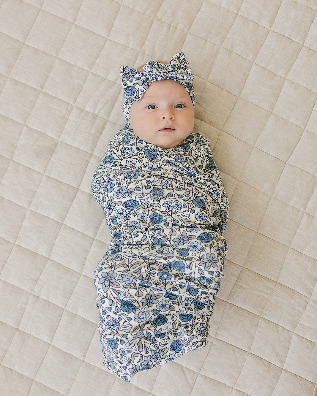 Baby head wrap with blue-and-white floral print and top knot bow