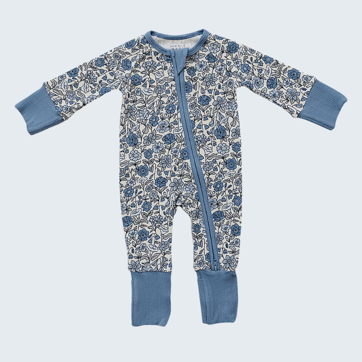 Baby onesie with floral pattern and blue accents on a light gray background