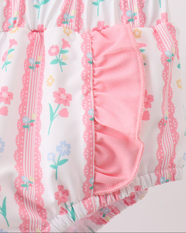 Close up of floral swimsuit bottoms with ruffles