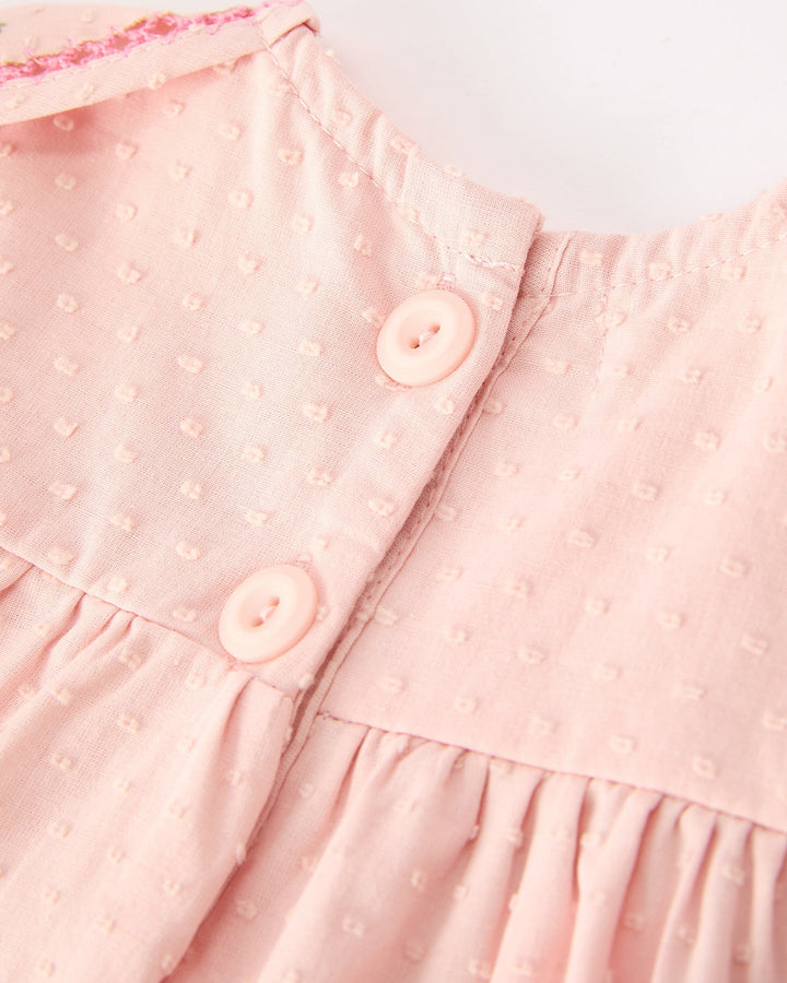 Pink dress bodice with button placket and stitched trim detail