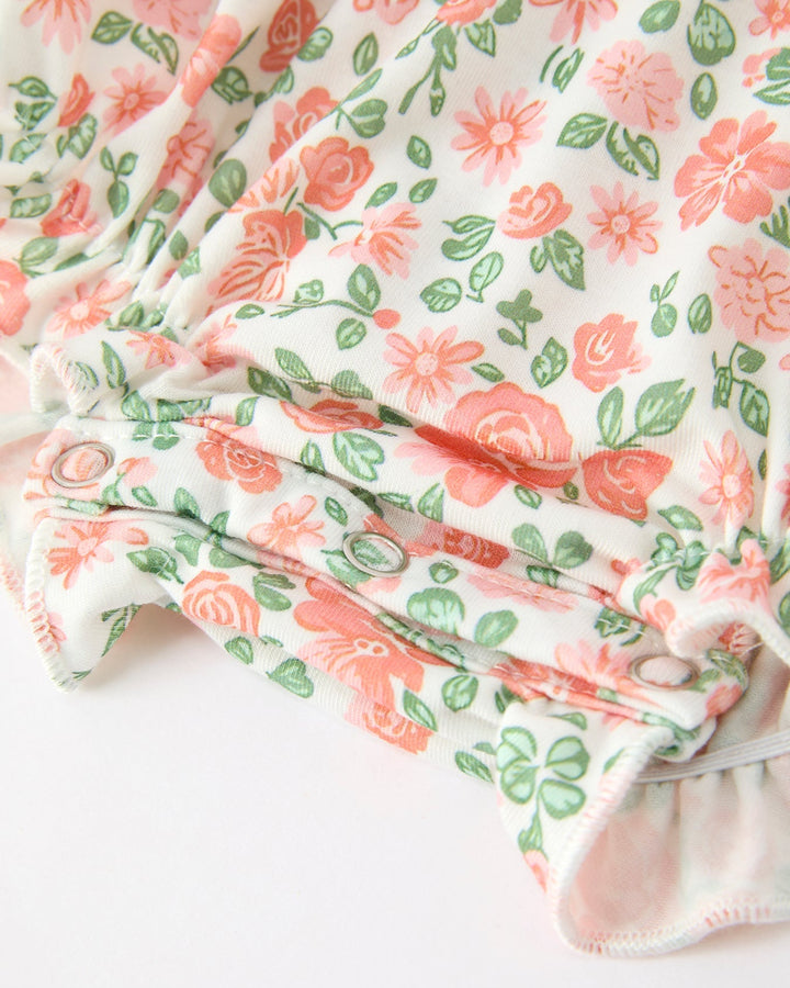 Floral baby romper sleeve cuff with soft ruffles and gathered hem